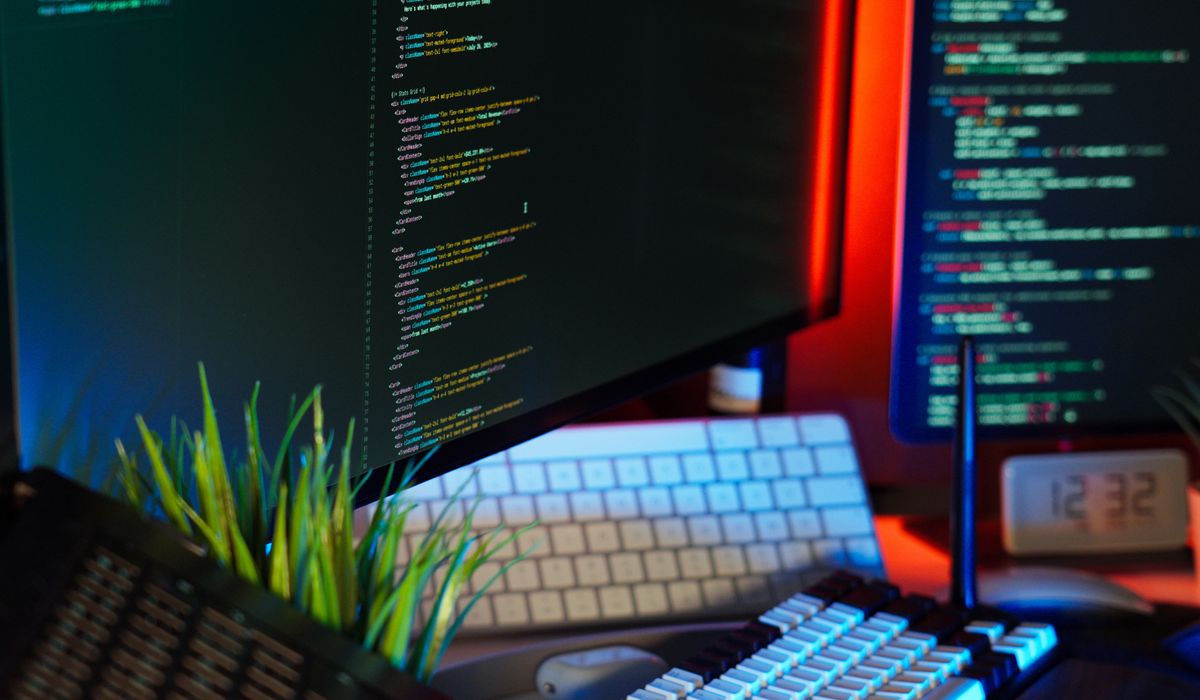 Web design workspace with a laptop and notes